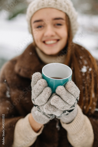 girl drinking hot coffee in winter