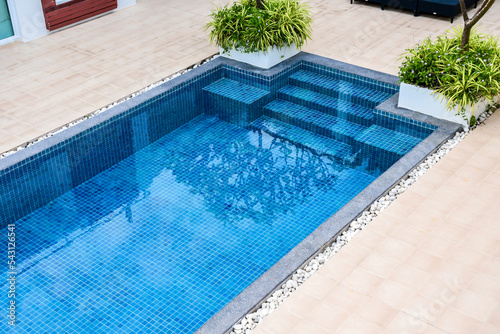 Swimming pool with view garden at resort.