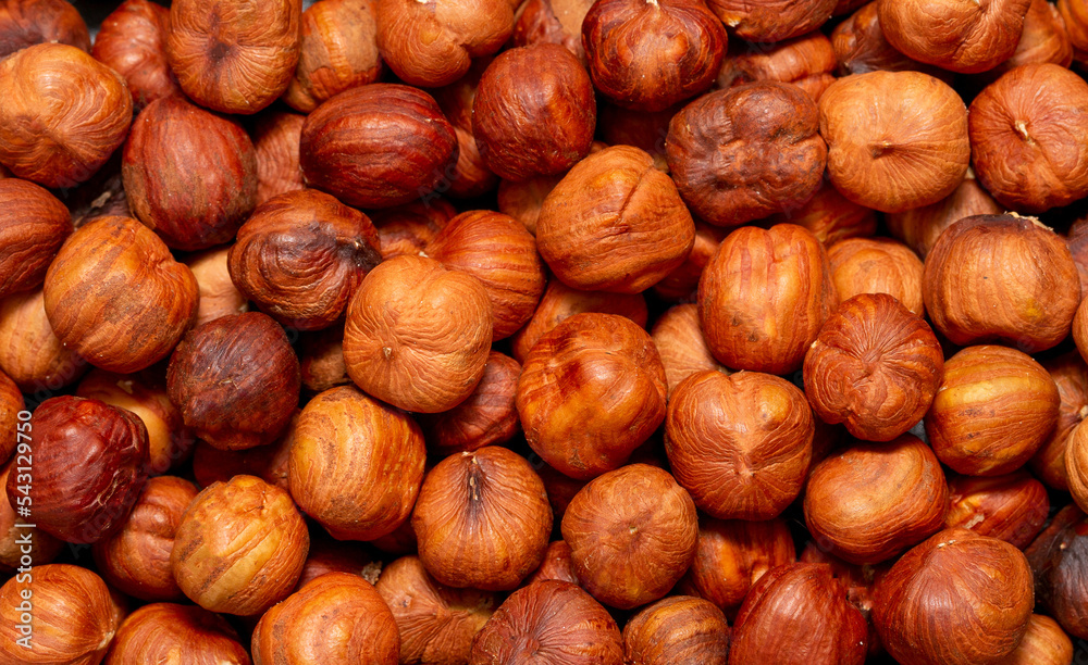 Heap of hazelnuts close-up. Peeled nuts. Hazelnut isolated on white background. Heap of hazelnuts close-up. Peeled nuts. Hazelnut isolated on white background.