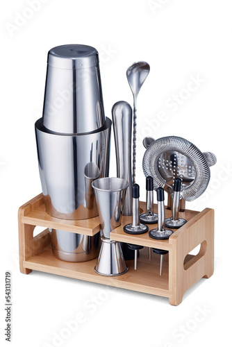 Close-up shot of a bar set, including 10 accessories: a shaker, a jigger, a strainer, a muddler, 4 geysers for bottles, a bar spoon and a wooden stand. Bar accessories are on a white background.