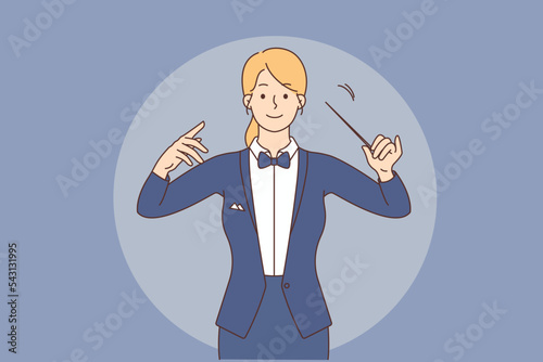 Female conductor with baton in hands 