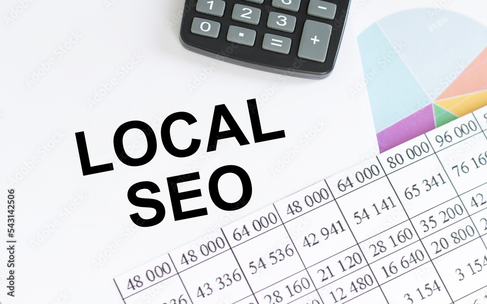 and a white notepad with the text LOCAL SEO lie on a table with task lighting. View from above. Business concept. and a white notepad with the text LOCAL SEO lie on a table with task lighting. View from above. Business concept.