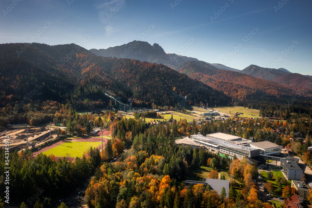 Aerial view of the Zakopane town uder Tatra mountains at autumn. Poland - obrazy, fototapety, plakaty 