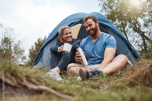 Love, couple and camp with tent, coffee and smile and with flask in nature and happy. Romance, man and woman bonding, romantic getaway and camping for happiness, connect and laugh together in morning photo
