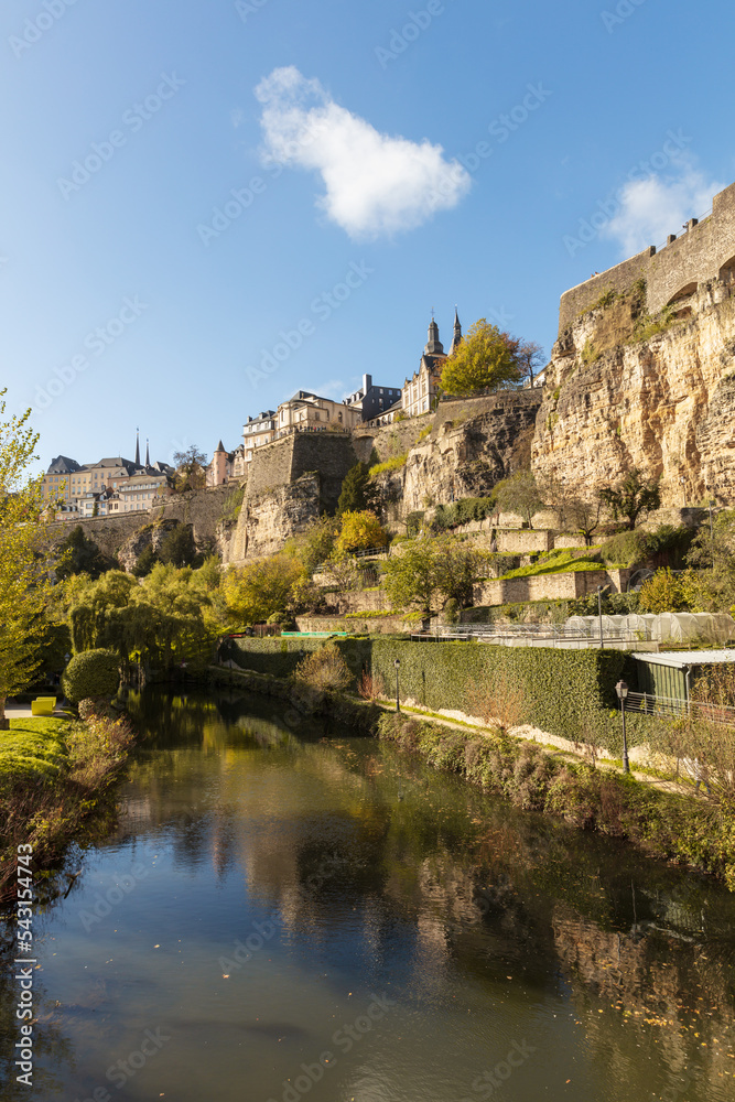 Fototapeta premium w of the Pétrusse river, old fortress and bock casmeates in Luxembourg City with urban garden. Wenzel Pad.