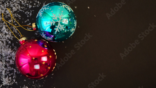  ..beautiful black christmas background for postcards, flyers, banners. Christmas tree branch and Christmas balls and toys