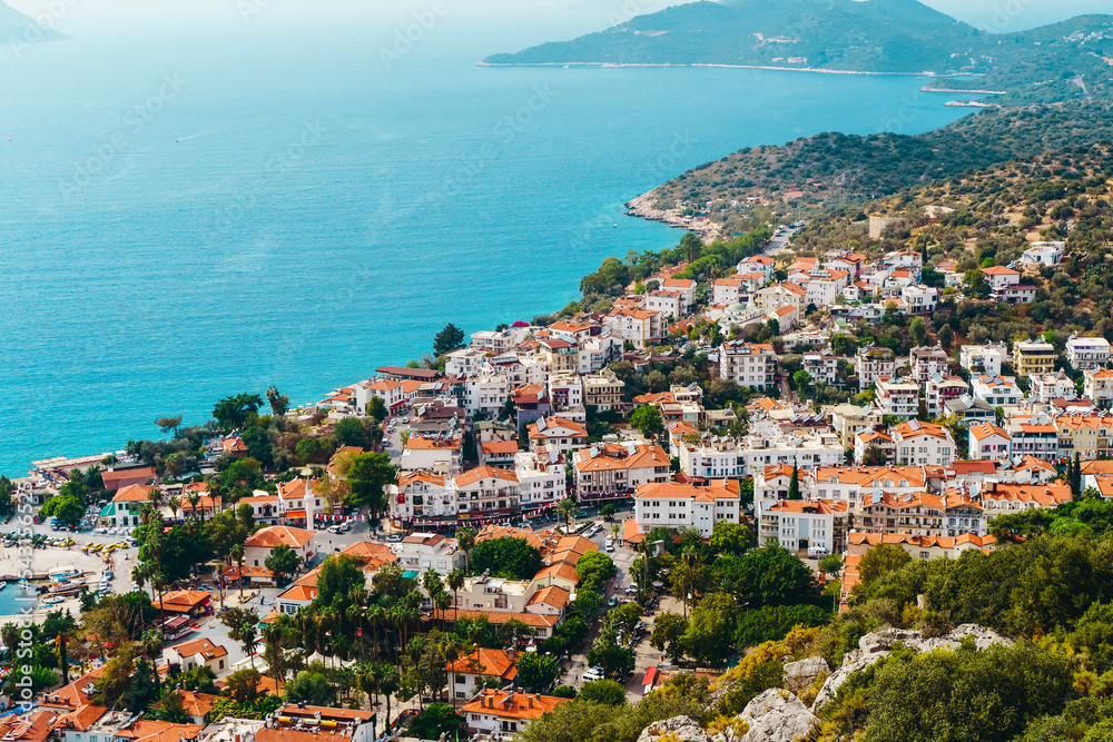 View of the panorama of the Turkish city of Kas from above. Tourist attractions of Turkey and Mediterranean Sea. Travel, vacation, tourism concept.