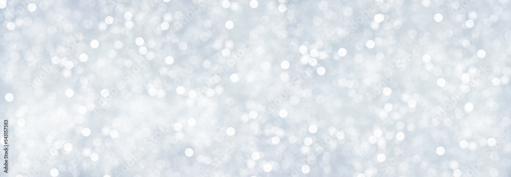 Panorama of decorative Christmas background with bokeh lights and snowflakes.