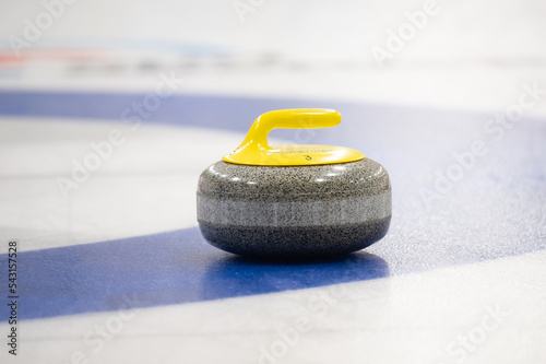 Curling rock on the ice 