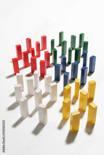 Wooden dominoes divided into groups of colors