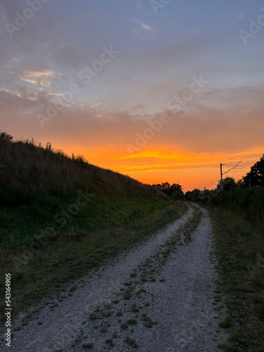 Orange sunset in the rural field 