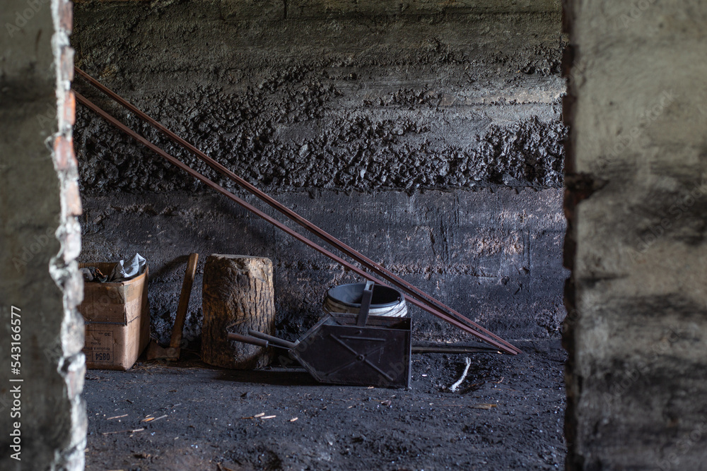 Empty and dirty coal cellar. StockFoto Adobe Stock