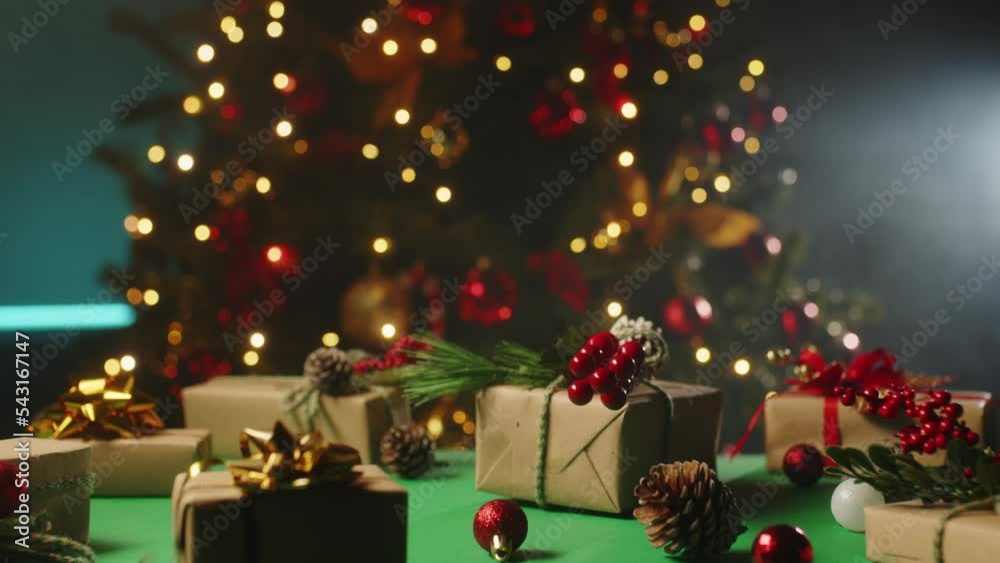 Table full of Presents for Christmas time against the tree