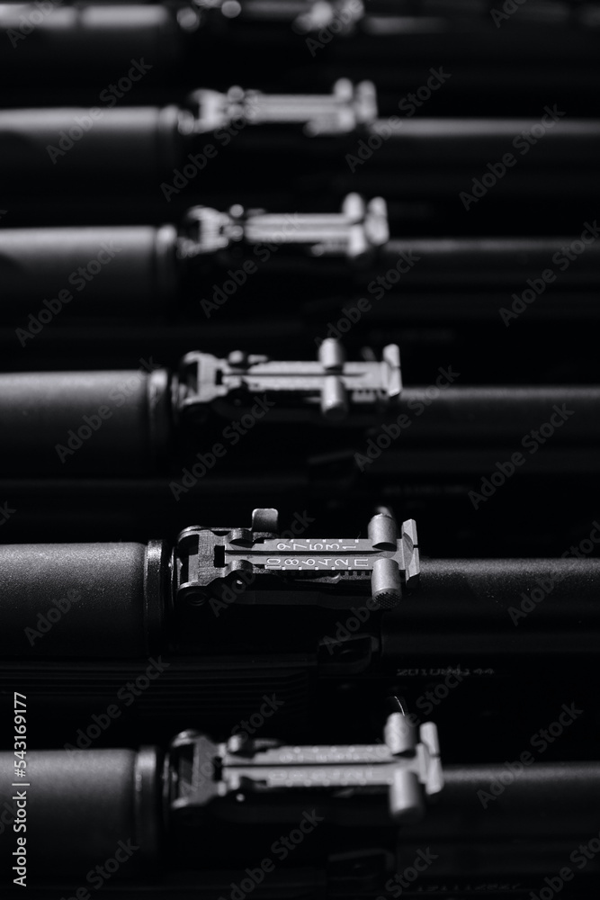 Stocks of weapons. New automatic rifles in a box. The sighting bar of