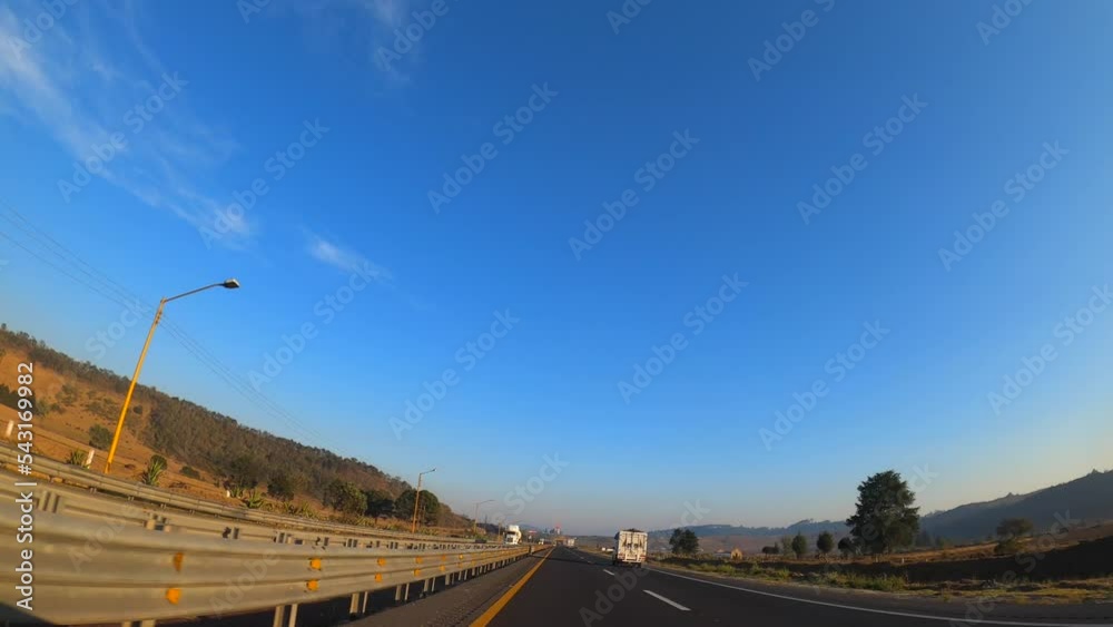Driving through a Mexican highway at sunset. Driving through a Mexican highway at sunset.
