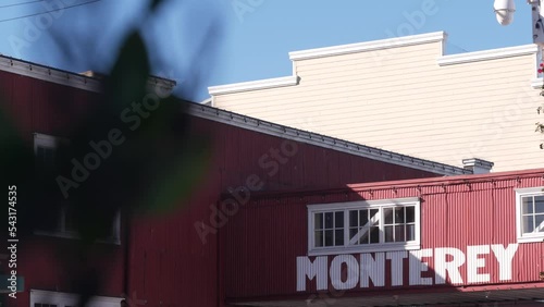 Cannery row in Monterey city, California tourist landmark, USA. Historic fisherman wharf, famous retro industrial street with canning companies and sardines factory. Travel destination or sightseeing. photo