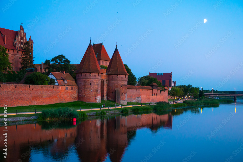 Marienburg castle the largest medieval brick castle in the world in the city of Malbork evening view at night