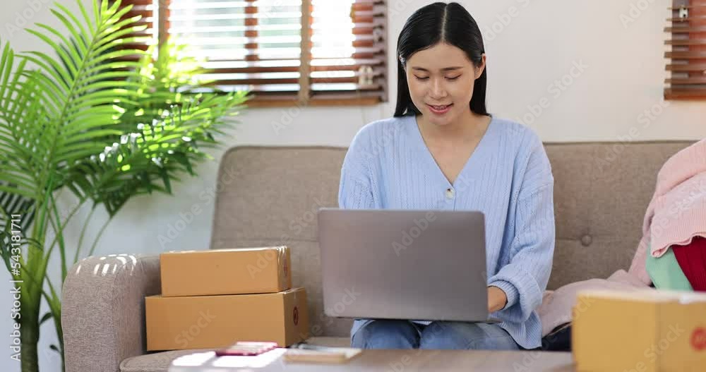 Portrait young attractive hipster asia female owner startup work happy with box at home prepare parcel delivery in sme supply chain, procurement, Asian omnichannel Sme ecommerce online concept. Portrait young attractive hipster asia female owner startup work happy with box at home prepare parcel delivery in sme supply chain, procurement, Asian omnichannel Sme ecommerce online concept.
