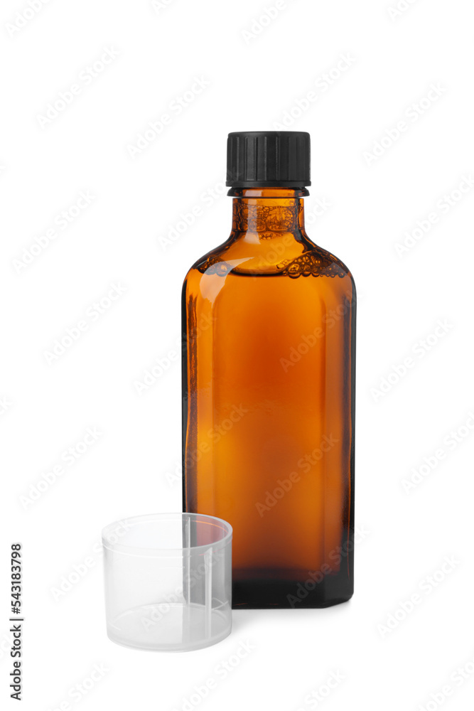 Bottle of syrup with measuring cup on white background. Cough and cold medicine