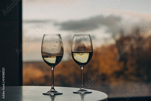 Two glasses against the background of an autumn landscape