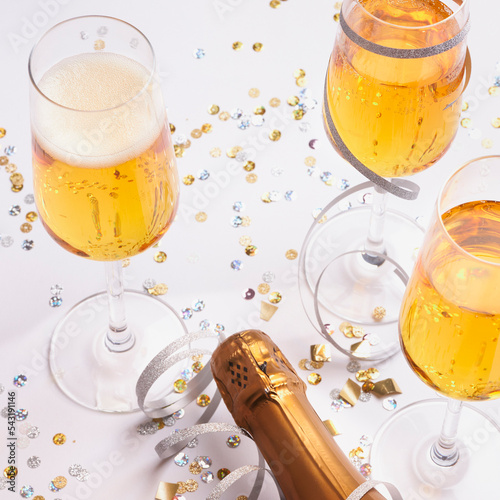festive champagne glasses with bottle ready for new year