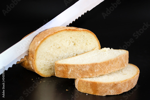 Close up Bread Knife Slicing Through a Loaf