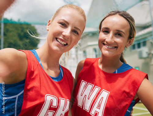 Selfie, sports and women team smile after a competition or game on netball court, field or outdoor park in Australia with cellphone for social media. Happy netball people or friends in photo portrait photo