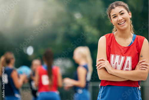 Sports, netball and portrait of active woman on court ready for training, winning and playing game. Fitness, wellness and female athlete standing in outdoor park with team for exercise and workout