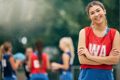 Fototapeta Naklejka Na Ścianę i Meble -  Proud, sports and netball woman in portrait smile for success, training motivation and outdoor wellness challenge with team. Young, happy and healthy fitness teenager in game or competition on court