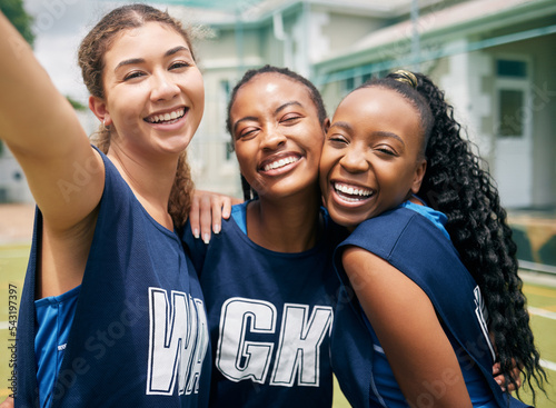 Sports, team and girl netball selfie, hug with fitness and college or school club with outdoor portrait. Exercise, competitive sport and happy people, smile in picture and player training on court.