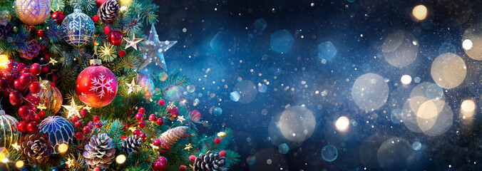 Christmas Tree With Baubles In Blue Night - Ornaments On Fir Branches With Glittering And Defocused Lights In Abstract Background