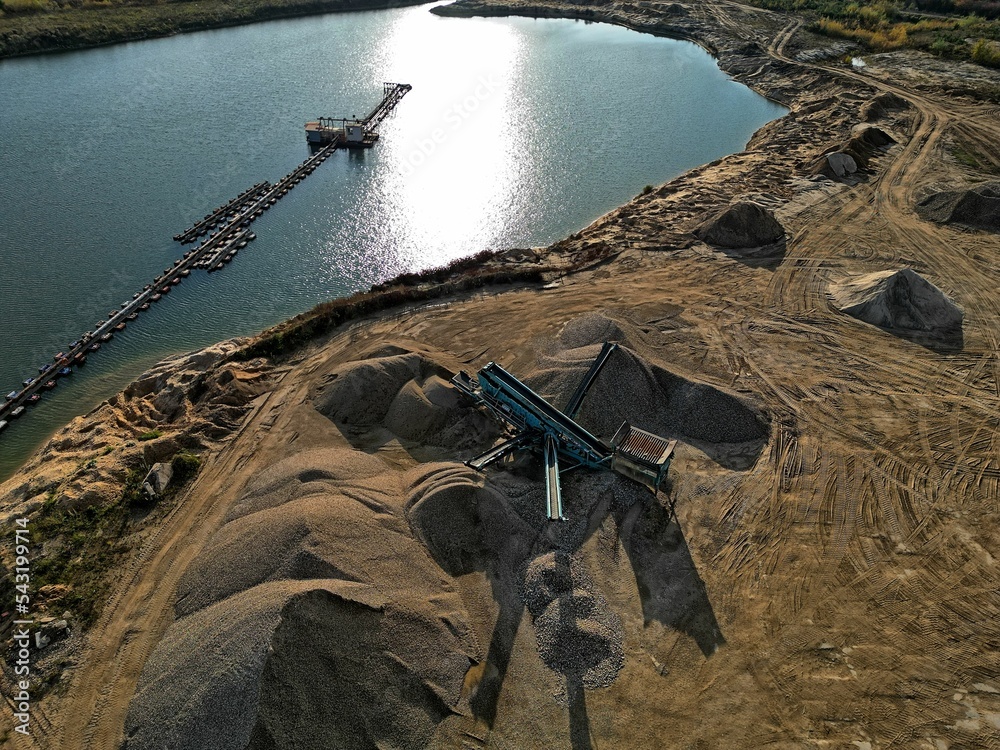 open pit mine and selection of raw materials and minerals extracted from the ground