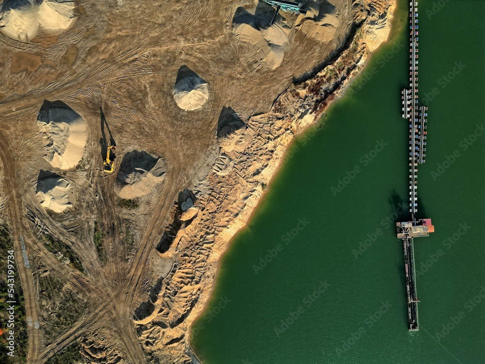 open pit mine and selection of raw materials and minerals extracted from the ground