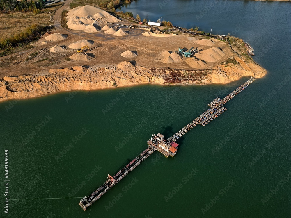 open pit mine and selection of raw materials and minerals extracted from the ground