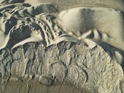 open pit mine and selection of raw materials and minerals extracted from the ground	