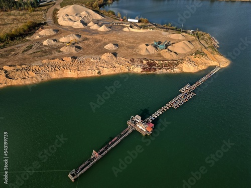 Obraz na płótnie open pit mine and selection of raw materials and minerals extracted from the ground w salonie