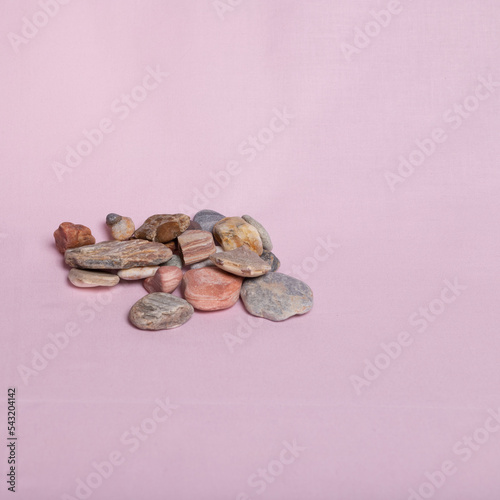4. Colorful stones on a pink background
