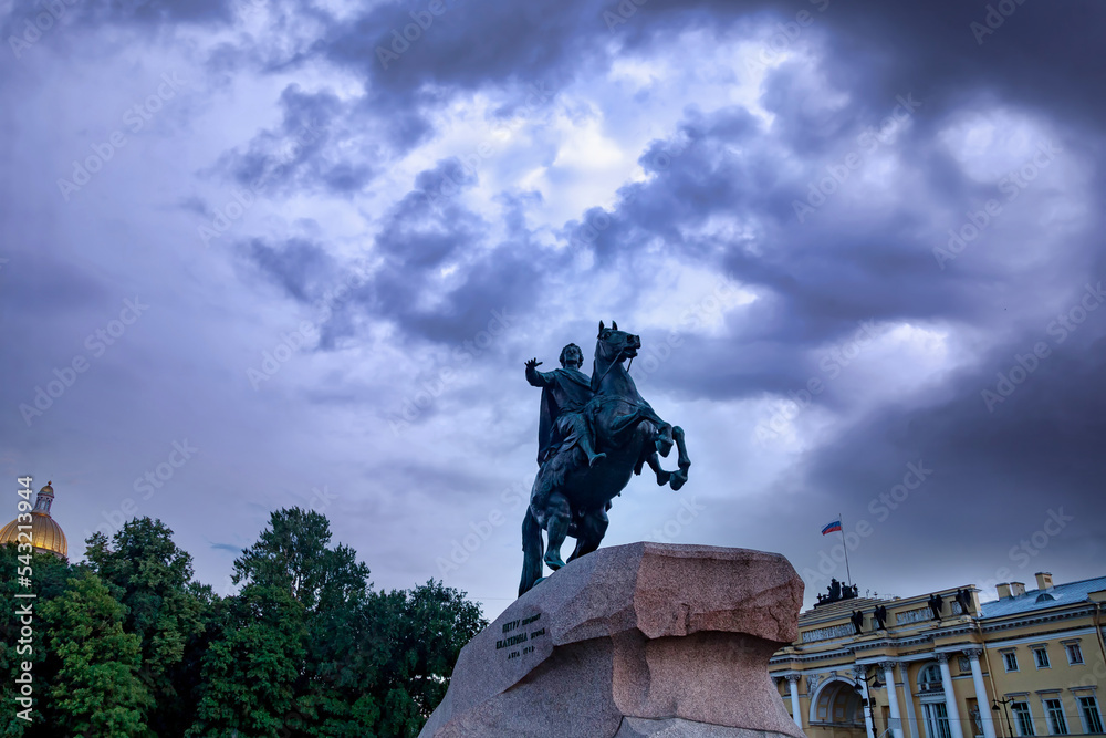 Bronze horseman monument on Neva river embankment at cloudy sky background. Unique urban landscape of Saint Petersburg. Central historical top tourist places in Russia, Capital Russian Empire