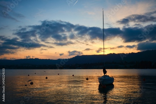 Beautiful shot of a boat on lake Zurich, Switzerland during a sunset