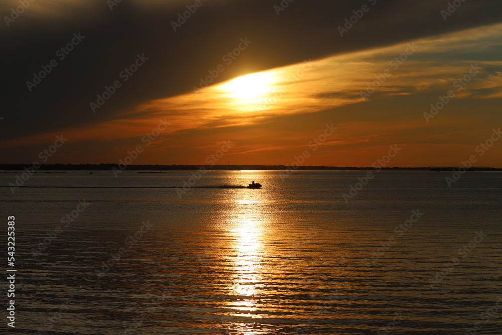 Naklejka premium The sun sets below the horizon on the Mediterranean Sea in northern Israel.