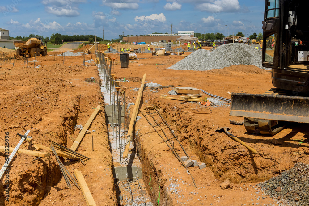 Throughout construction site steel bars rebar wires have been placed ...