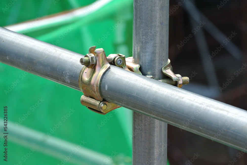 SELANGOR, MALAYSIA -FEBRUARY 26, 2015: Scaffolding connector detail at the construction site. The connector bind two scaffolding or safety pipe together. 