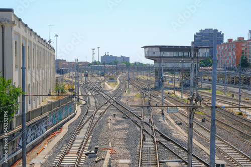 Transportation industry. Movement activity. Railway in the city across sky and city landscape. Bologna, Italy