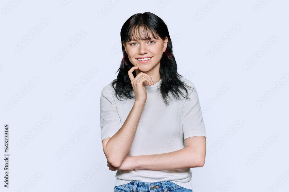 Beautiful young female looking at camera on white background Beautiful young female looking at camera on white background