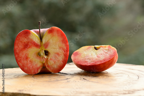 Close up of apple type with red, white, yellow and pink pulp