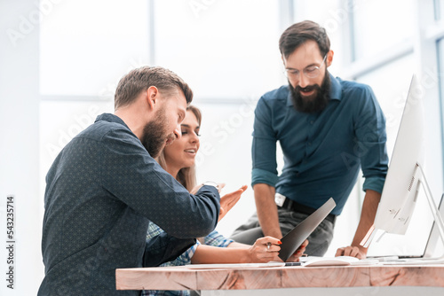 colleagues extending their hands to each other for a handshake