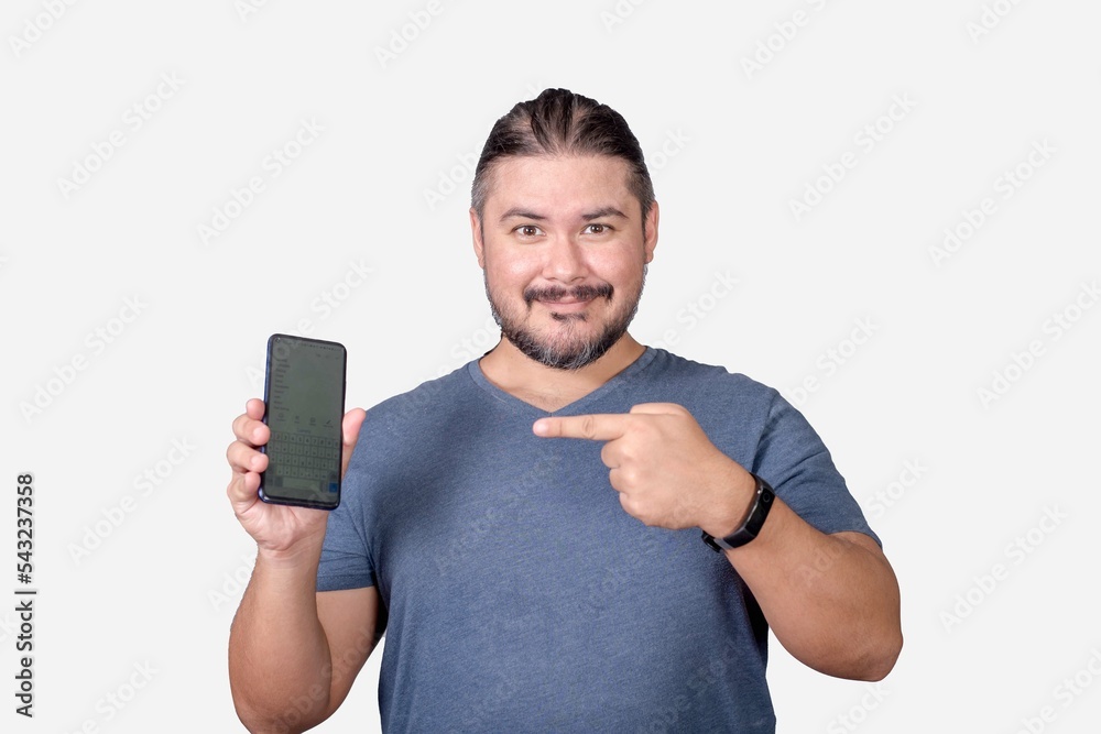 A friendly man in his 30s showing his smartphone. Pointing to the cellphone with his index finger. Advertising an app. A friendly man in his 30s showing his smartphone. Pointing to the cellphone with his index finger. Advertising an app.