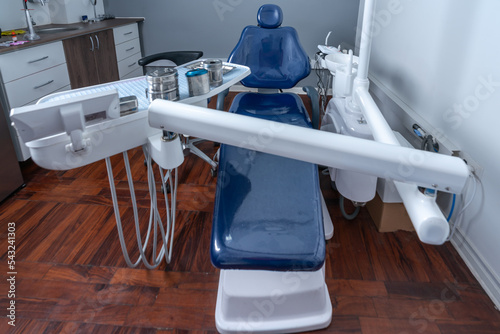 Dental chair and instruments in modern stomatological clinic photo