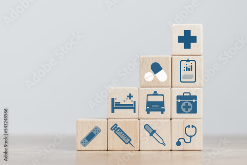 insurance concept, a man's hand is building a cube wood to show the decision about life insurance to plan the future for themselves and their families on money, health and tax breaks.