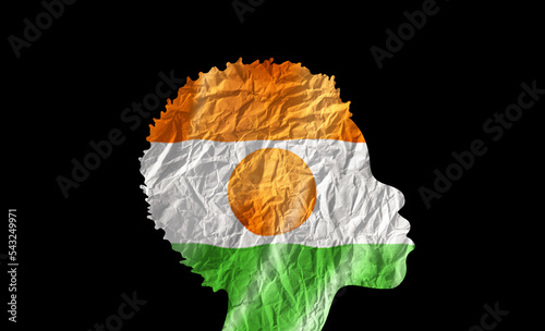 African woman silhouette with Niger national flag. photo